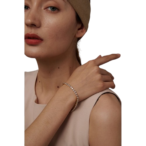 Woman wearing a bracelet with a neutral background