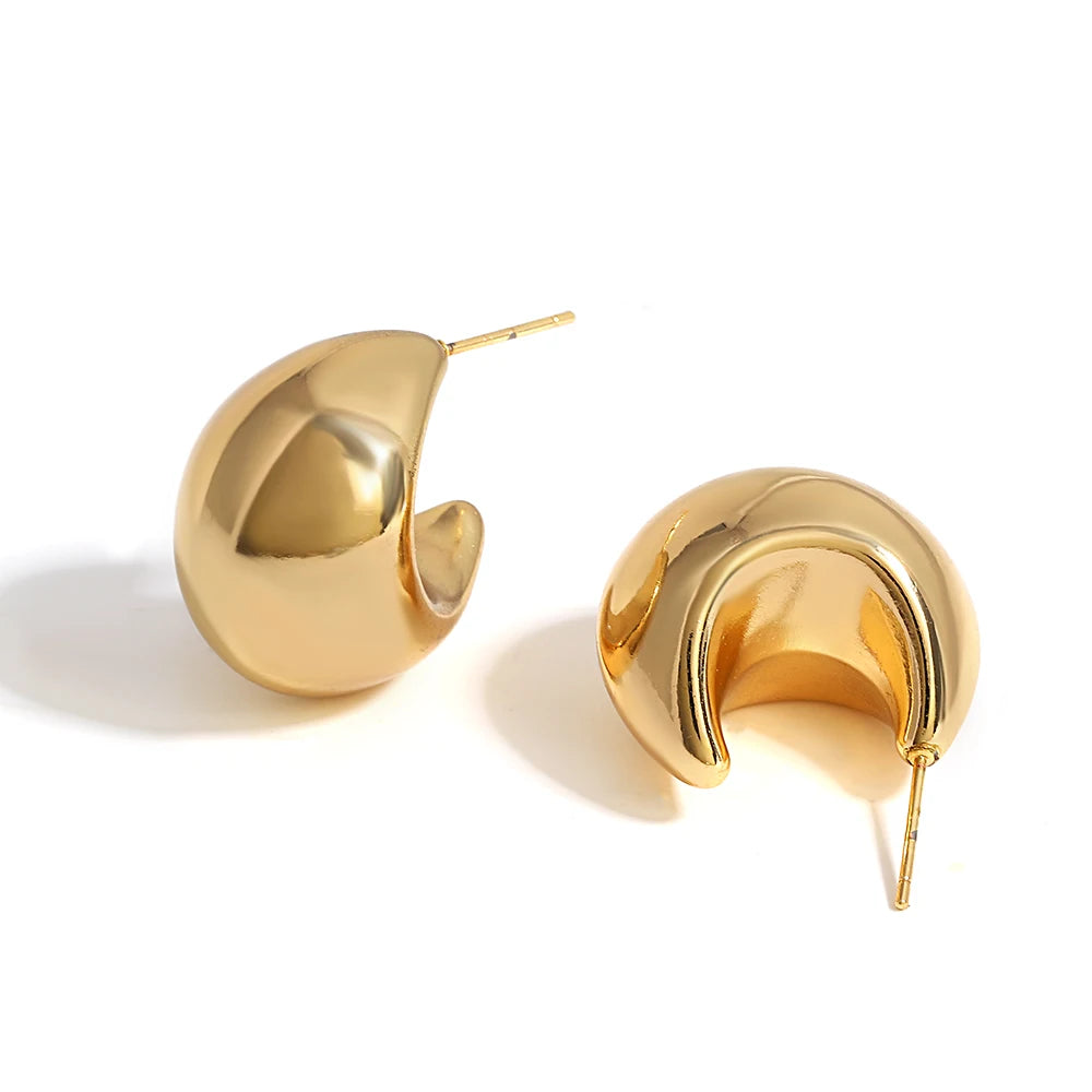 Gold hoop earrings on a white background