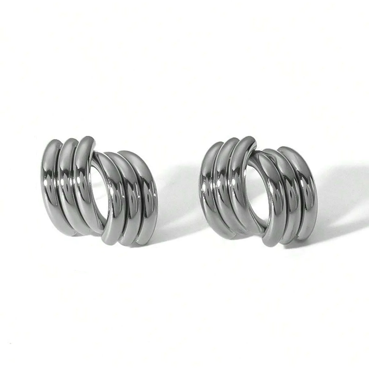 Close-up of a curtain rod with metal coils and dimensions on a white background