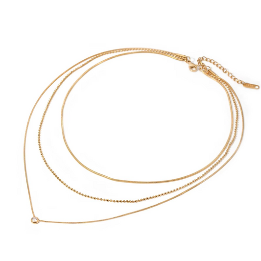 Gold necklace on a white background