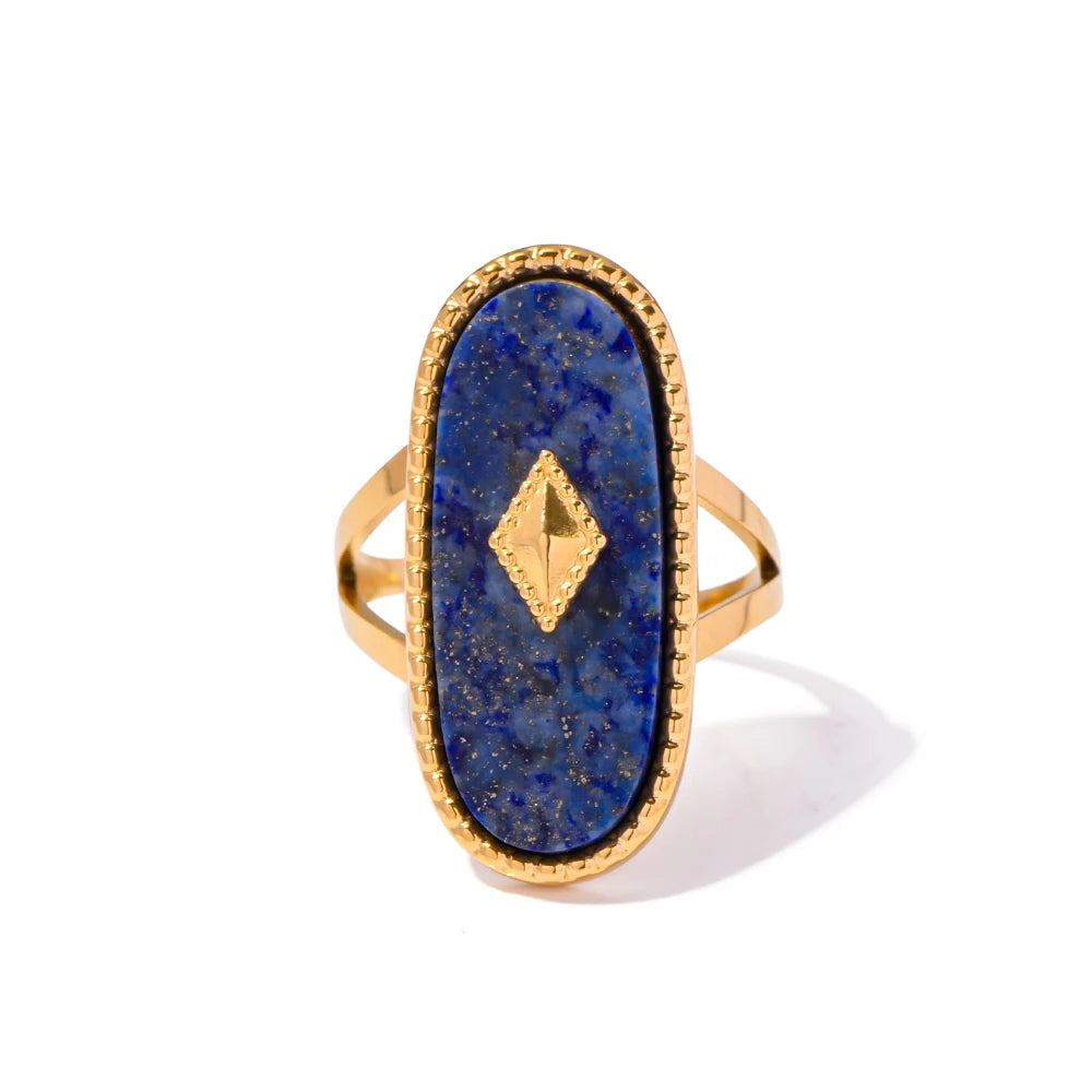 Gold ring with a blue stone and gold diamond on a white background