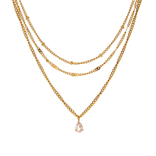 Three gold necklaces with a teardrop pendant on a white background