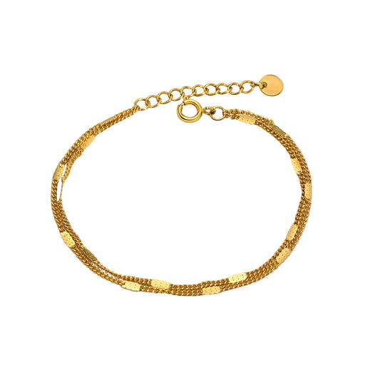 Gold bracelet on a white background