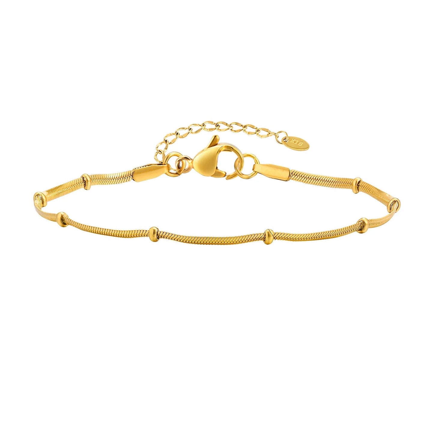 Gold bracelet with measurements on a white background