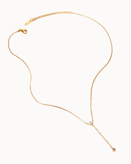Gold necklace on a white background